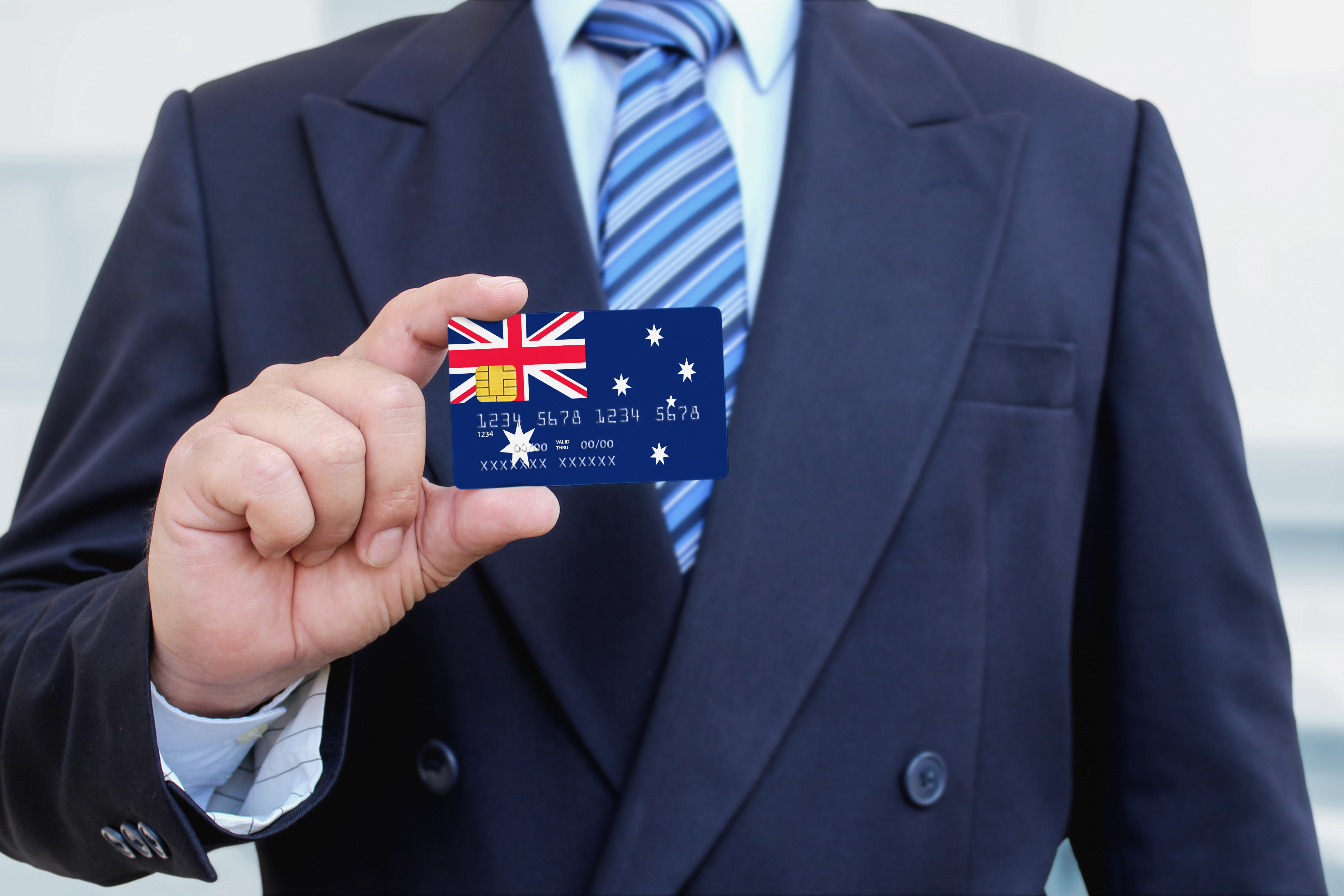 The man with the card participating in program for investors and businessmen in Australia