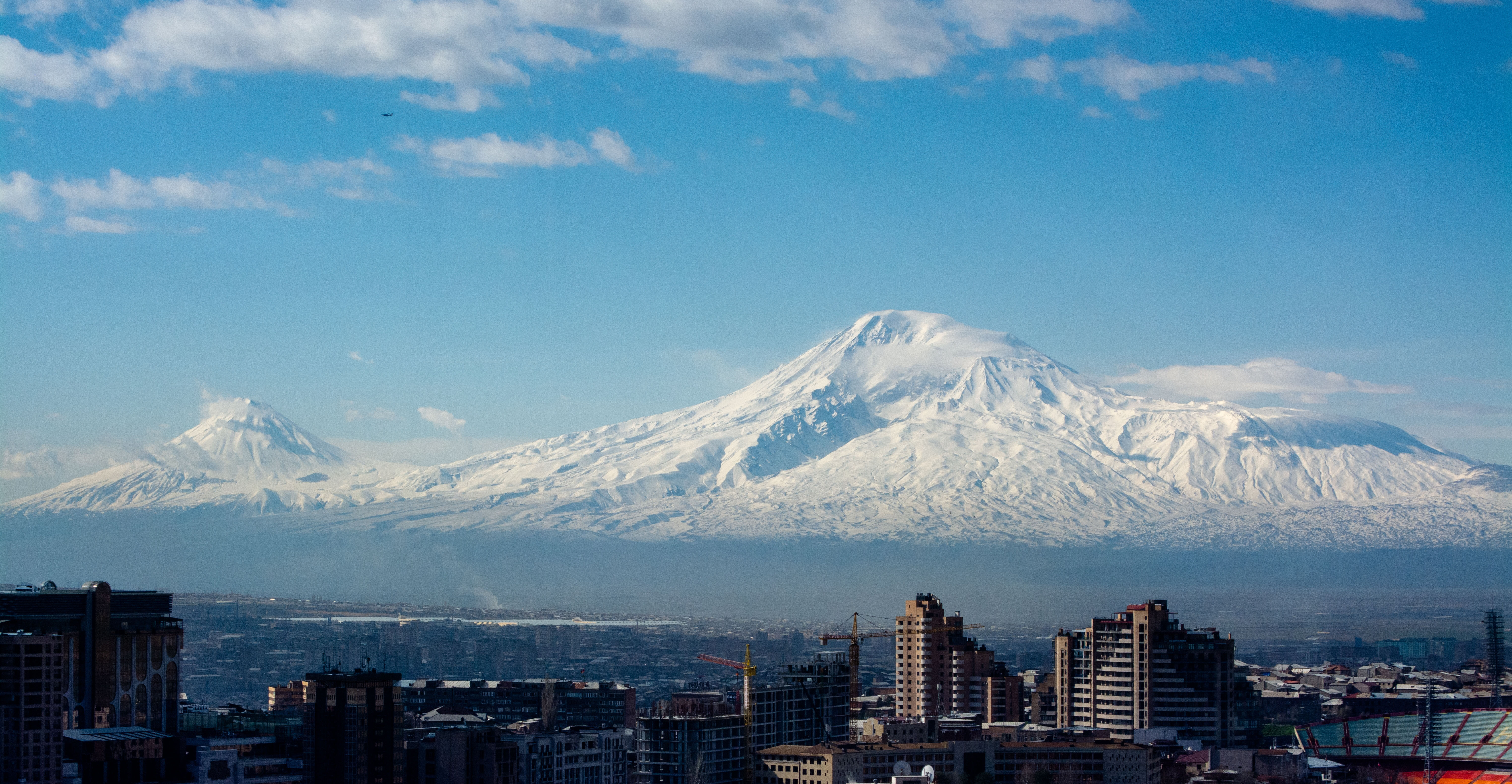 A city in Armenia against the backdrop of mountains