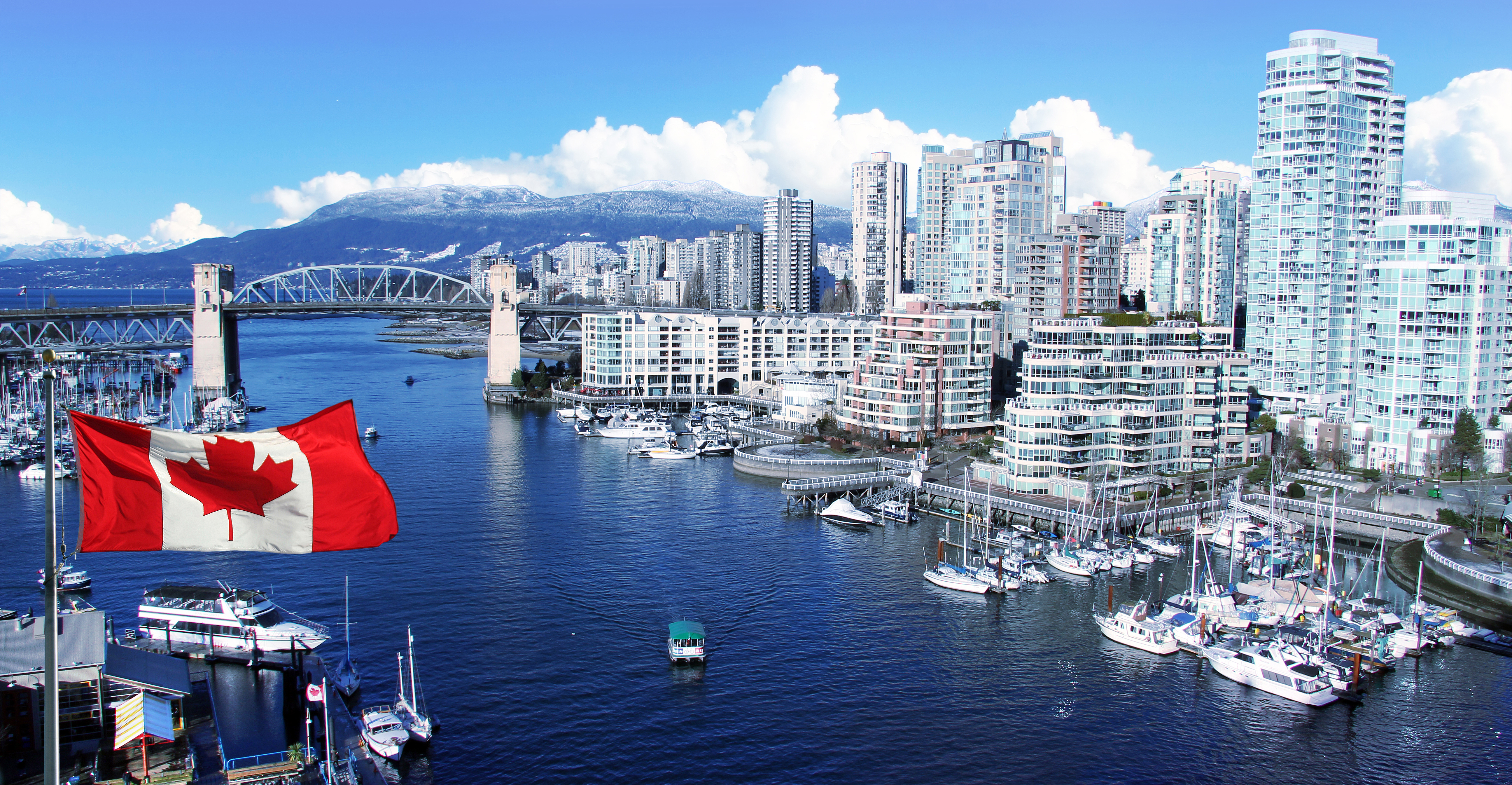 A view of a city in Canada with a flag